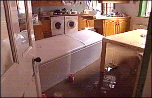 The downstairs of a house is filled with dirty, freezing water