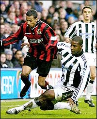 Titus Bramble tackles DJ Campbell as the Premier League side start to impress