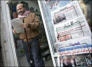 A man buys a newspaper in Ramallah in the West Bank
