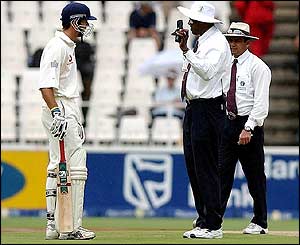 Michael Vaughan consults with the umpires