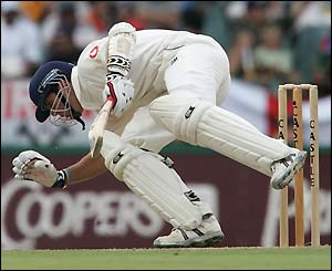 Michael Vaughan ducks under a vigorous delivery from Jacques Kallis