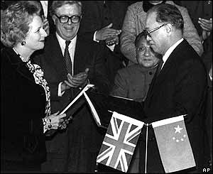 UK Prime Minister Margaret Thatcher (left) and Chinese Premier Zhao Ziyang (right) exchange signed copies of the Hong Kong handover agreement to China, Beijing, 19 December 1984