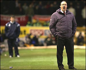 Steve Cotterill looks on as Rafael Benitez tries to rally his players