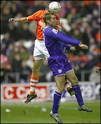 James Scowcroft looks to score Leicester's second as they struggle at a windy Bloomfield Road