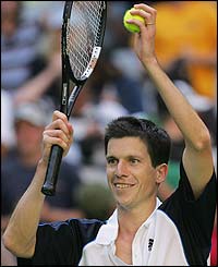Tim Henman applauds the crowd