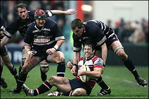 Andy Gomarsall is tackled by Ollie Hodge of Bristol