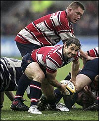 Gloucester's Andy Gomarsall releases the ball