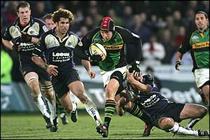 Bruce Reihana of Northampton's grabbed by Colm Rigney