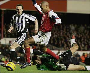 Thierry Henry tries to get past Shay Given 
