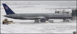 Airport crews remove snow from LaGuardia Airport in New York