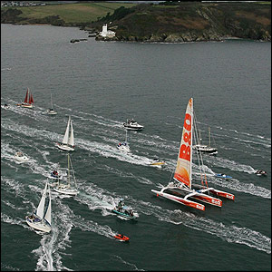A flotilla of well wishers turns out to send MacArthur on her way at the island of Ushant off the north coast of France 