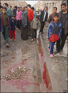 Blood on the street marks the location of a suicide bombing in Baghdad