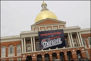 A banner on State House congratulates New England