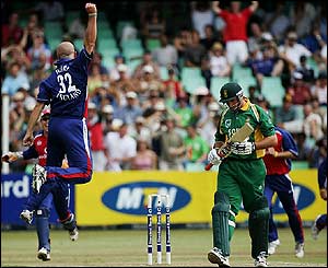 Alex Wharf celebrates taking the wicket of Graeme Smith