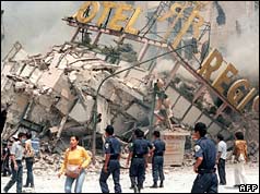 Wrecked building with hotel sign visible