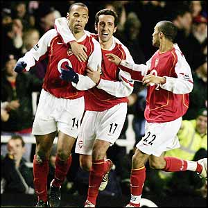 Thierry Henry is congratulated by his team-mates after getting Arsenal's third goal
