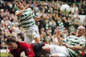 John Hartson is through on goal but is bravely denied by Roland Waterreus - picture from Action Images