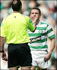The referee has words with Craig Bellamy 