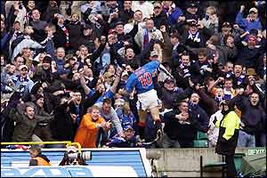 Nacho Novo celebrates his goal with the Rangers fans - picture from Action Images