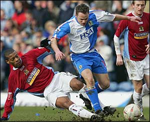 Micah Hyde of Burnley and Paul Dickov of Blackburn Rovers