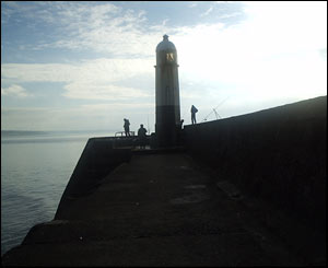 Fishermen on Porthcawl harbour wall, taken by Dominic Gilliatt aged eight from Rhoose