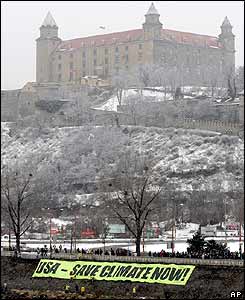 Greenpeace activists display a banner near the Bratislava Castle
