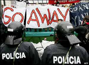 Police stand guard between protesters in Bratislava