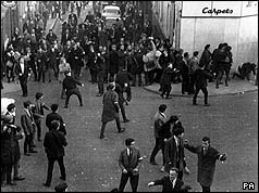 Demonstrators - some look as though they are throwing missiles