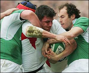 England's Martin Corry is shackled by the Irish pack