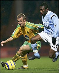 Shaun Wright-Phillips (R) tussles with Mattias Jonson