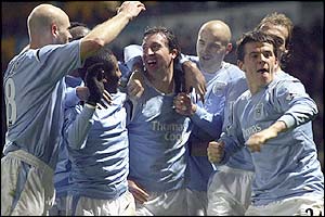 Man City's players celebrate Fowler's winner