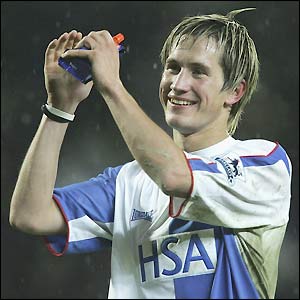 Morten Gamst Pedersen salutes the Ewood Park faithful after helping to take his side through to the next round