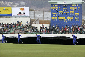 With half the day's play lost to rain, the groundstaff are kept busy