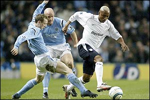 Bolton's El Hadji Diouf heads towards goal