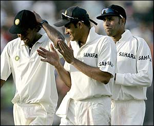 India's Lakshmipathy Balaji is applauded off the field by team-mates Anil Kumble and VVS Laxman