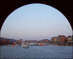 Looking out at Swansea Marina, from an archway in a block of waterside flats (Sian Thomas, Swansea)