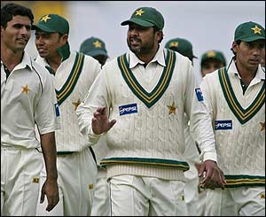 Inzamam-ul Haq leads his team off