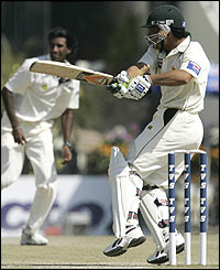 Kamran Akmal defends the wicket off the bowling of Laxmipathy Balaji