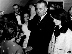 Lyndon Johnson is sworn in as Jacqui Kennedy looks on