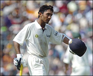 Karthik walks back to the pavillion after being dismissed by Dinesh Kaneria