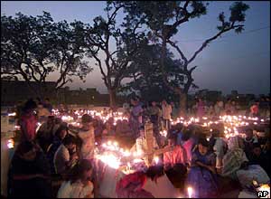Christians pray at the graves of their relatives in Purulia, India