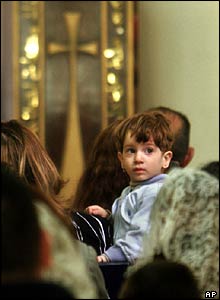 An Iraqi boy looks about during Easter services at the Virgin Mary Church in Baghdad, Iraq 