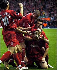 Sami Hyypia is mobbed by his team-mates