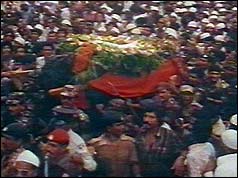 Coffin amid huge crowds