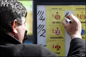 A bookmaker amends the race odds