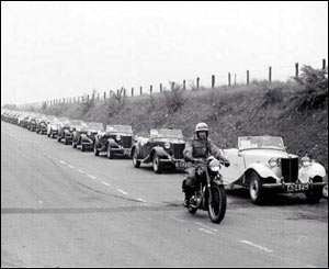 A convoy of MG TD Midgets on the way to Avonmouth, Bristol, for shipment to the USA
