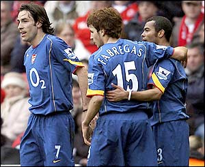 Robert Pires is congratulated by Cesc Fabregas and Ashley Cole after his goal