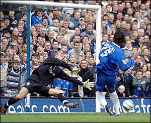 Didier Drogba steers the ball past Birmingham keeper Maik Taylor for Chelsea's equaliser