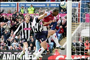 Villa striker Darius Vassell nods home to put his side ahead