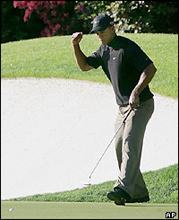 Tiger Woods celebrates a birdie